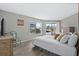 This comfortable bedroom features a queen bed and lovely views from its large windows at 4234 Pinehurst Circle # L1, Little River, SC 29566