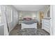 This lovely bedroom features a queen bed, a large rug and white furnishings at 4234 Pinehurst Circle # L1, Little River, SC 29566