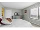 The bedroom features modern decor, a comfortable queen bed and a unique distressed teal accent chair at 4234 Pinehurst Circle # L1, Little River, SC 29566
