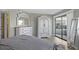 This light-filled bedroom offers an exterior door, white furnishings and lots of natural light at 4234 Pinehurst Circle # L1, Little River, SC 29566
