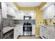 Updated kitchen featuring stainless steel appliances, granite countertops, and modern tile backsplash at 4234 Pinehurst Circle # L1, Little River, SC 29566