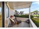 Inviting outdoor patio with wicker furniture, potted plants, and a serene neighborhood view at 4234 Pinehurst Circle # L1, Little River, SC 29566