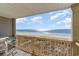 Balcony view showing the beach and ocean on a sunny day at 4305 S Ocean Blvd. # 301, North Myrtle Beach, SC 29582