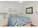Bedroom with hardwood floors, natural light, and built-in shelves with dressers underneath at 4305 S Ocean Blvd. # 301, North Myrtle Beach, SC 29582