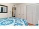 Bedroom with hardwood floors, natural light, and laundry unit access at 4305 S Ocean Blvd. # 301, North Myrtle Beach, SC 29582