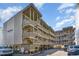 Beautiful multi-level beach condo with outdoor stairs and wood facade near the ocean and under sunny skies at 4305 S Ocean Blvd. # 301, North Myrtle Beach, SC 29582