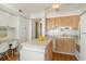 Bright kitchen with white and wood cabinets and a convenient island workspace at 4305 S Ocean Blvd. # 301, North Myrtle Beach, SC 29582