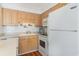 Kitchen boasts bright cabinets, clean appliances, and bright decor at 4305 S Ocean Blvd. # 301, North Myrtle Beach, SC 29582