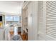 View of the ocean through the sliding glass doors over the office nook and living area at 4305 S Ocean Blvd. # 301, North Myrtle Beach, SC 29582