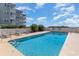 Community pool area with lounge chairs at 4305 S Ocean Blvd. # 301, North Myrtle Beach, SC 29582