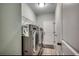 A well-equipped laundry room with a washer and dryer and storage at 4437 Marshwood Dr., Myrtle Beach, SC 29579