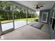 Screened-in porch with an outdoor fan at 4437 Marshwood Dr., Myrtle Beach, SC 29579