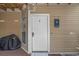 Condo unit entrance featuring white door, welcome decor, and porch area at 4500 S Ocean Blvd. # 9-B, North Myrtle Beach, SC 29582