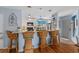 Kitchen area featuring bar seating and open access to the main entrance and dining area at 4500 S Ocean Blvd. # 9-B, North Myrtle Beach, SC 29582
