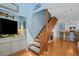 Inviting living area with a staircase, TV, and an open view into the kitchen at 4500 S Ocean Blvd. # 9-B, North Myrtle Beach, SC 29582