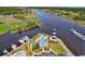 Lighthouse view of the waterway, pool, and marina, located in a gated community with mature landscaping at 4652 Lightkeepers Way # 38-C, Little River, SC 29566
