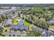 Aerial view of a residential community featuring lush landscaping and a marina nearby at 4652 Lightkeepers Way # 38-C, Little River, SC 29566