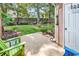 Well maintained backyard featuring green lawn, wood fence, and access door at 4652 Lightkeepers Way # 38-C, Little River, SC 29566