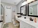 Bathroom featuring a double sink vanity, black fixtures, and modern finishes at 4652 Lightkeepers Way # 38-C, Little River, SC 29566