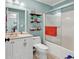 Stylish bathroom with a shower, toilet, vanity, decorative shelves, and refreshing blue walls at 4652 Lightkeepers Way # 38-C, Little River, SC 29566