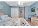 Charming bedroom with a ceiling fan, coastal decor, and serene blue walls at 4652 Lightkeepers Way # 38-C, Little River, SC 29566