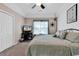 Relaxing bedroom with a TV, closet, comfortable bed, and light-filled window at 4652 Lightkeepers Way # 38-C, Little River, SC 29566
