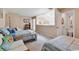 Comfortable bedroom with two queen beds, cozy seating, and a view into a bathroom at 4652 Lightkeepers Way # 38-C, Little River, SC 29566