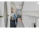 Upstairs hallway with an art niche, blue accents, and a cozy seating area by the window at 4652 Lightkeepers Way # 38-C, Little River, SC 29566