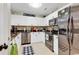 Bright kitchen featuring stainless steel appliances, white cabinets, and a tiled backsplash at 4652 Lightkeepers Way # 38-C, Little River, SC 29566