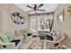Comfortable sunroom decorated with beach accents and wicker seating at 4652 Lightkeepers Way # 38-C, Little River, SC 29566