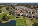 Aerial view of the property located next to the golf course, ponds and residential housing at 4709 Wild Iris Dr. # 305, Myrtle Beach, SC 29577
