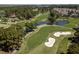 An aerial view highlights the lush green golf course with scenic ponds and sand traps at 4709 Wild Iris Dr. # 305, Myrtle Beach, SC 29577