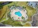 An aerial view of the community pool with palm trees and a walking trail at 4709 Wild Iris Dr. # 305, Myrtle Beach, SC 29577