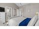 Comfortable bedroom leading to a brightly lit bathroom and closet space at 4709 Wild Iris Dr. # 305, Myrtle Beach, SC 29577