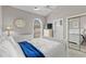 Bright bedroom featuring a vaulted ceiling, closet and large window for plenty of natural light at 4709 Wild Iris Dr. # 305, Myrtle Beach, SC 29577
