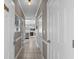 Inviting hallway with tile floors leads to an open-concept living space and kitchen at 4709 Wild Iris Dr. # 305, Myrtle Beach, SC 29577