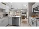 Bright kitchen with white cabinets, modern appliances, and an open view into the living area at 4709 Wild Iris Dr. # 305, Myrtle Beach, SC 29577