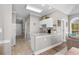 Convenient kitchenette with white cabinetry and access to other rooms at 4709 Wild Iris Dr. # 305, Myrtle Beach, SC 29577