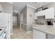 Practical kitchenette with white cabinets and essential appliances at 4709 Wild Iris Dr. # 305, Myrtle Beach, SC 29577