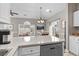 Well-equipped kitchenette with peninsula, sink, dishwasher, and access to the living room at 4709 Wild Iris Dr. # 305, Myrtle Beach, SC 29577