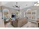 Living room features vaulted ceiling, large windows, and neutral colors, creating a cozy atmosphere at 4709 Wild Iris Dr. # 305, Myrtle Beach, SC 29577