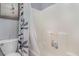 Well-lit bathroom with a shower/tub combo, featuring a neutral color scheme and decorative shower curtain at 478 Pinehurst Ln. # 17D, Pawleys Island, SC 29585