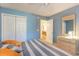 Bedroom with carpet flooring, ample closet space, and natural light, with a peek into another room at 478 Pinehurst Ln. # 17D, Pawleys Island, SC 29585