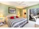 Relaxing bedroom featuring a ceiling fan, patio access and a large closet at 478 Pinehurst Ln. # 17D, Pawleys Island, SC 29585