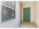Charming exterior view showcasing the front door and a window reflecting the interior ambiance at 478 Pinehurst Ln. # 17D, Pawleys Island, SC 29585