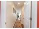 Inviting hallway featuring warm-toned walls and an elegant area rug leading to the living spaces at 478 Pinehurst Ln. # 17D, Pawleys Island, SC 29585