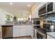 Bright kitchen featuring stainless appliances and a lovely view into the living area at 478 Pinehurst Ln. # 17D, Pawleys Island, SC 29585