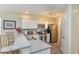 Beautiful kitchen featuring stainless appliances, a breakfast bar and white cabinets at 478 Pinehurst Ln. # 17D, Pawleys Island, SC 29585