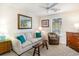 Inviting living room with a couch, ceiling fan, and natural light, creating a cozy atmosphere at 478 Pinehurst Ln. # 17D, Pawleys Island, SC 29585