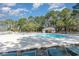 Beautiful community pool surrounded by lounge chairs and lush greenery, ideal for relaxation at 478 Pinehurst Ln. # 17D, Pawleys Island, SC 29585
